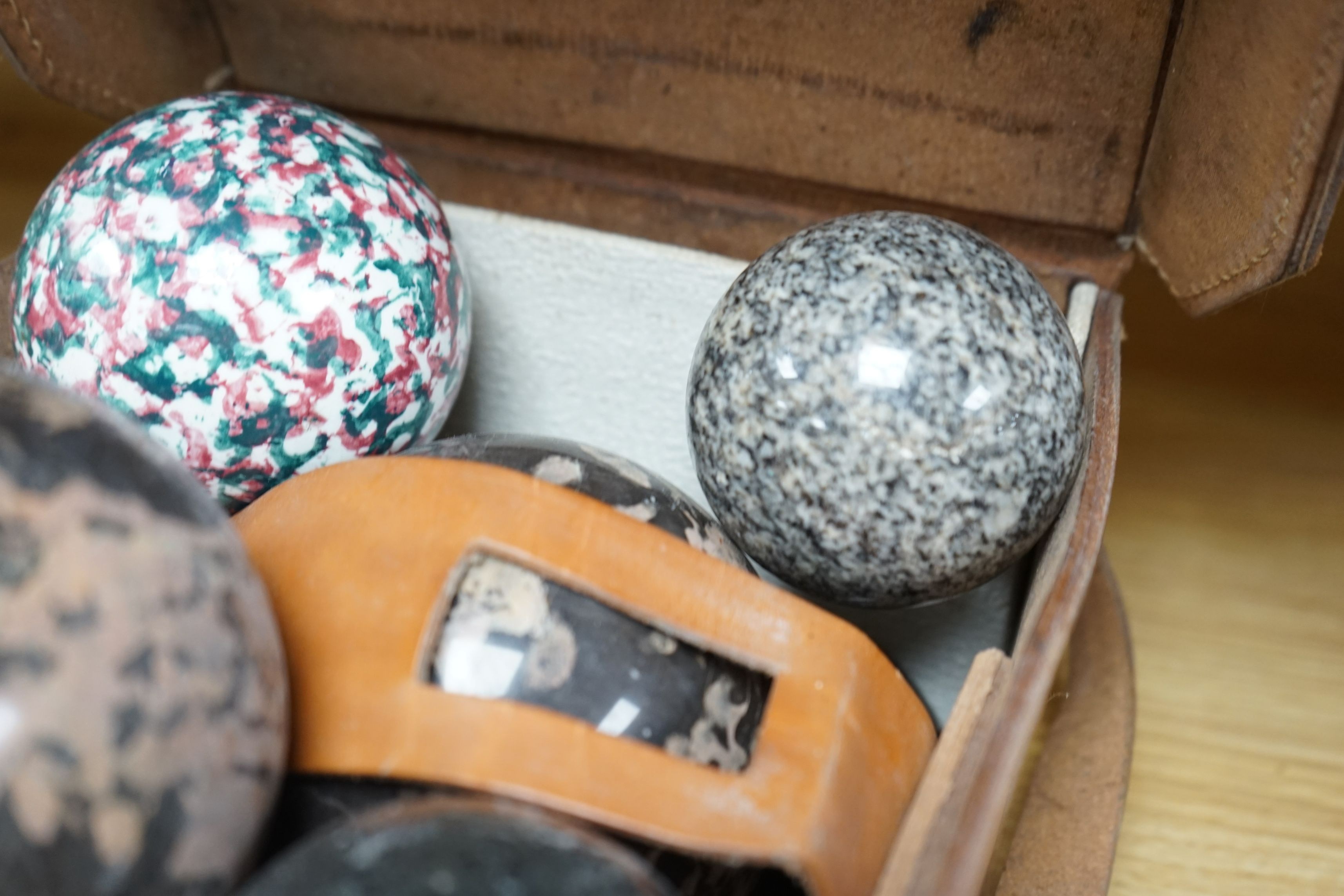 A collection of polished semi-precious stone eggs and balls